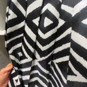 Black & white pleated. Knee length, full skirt